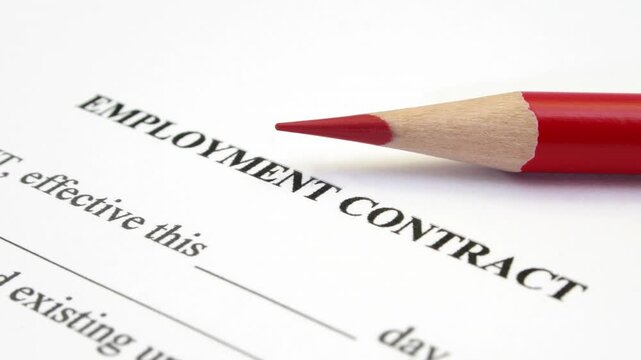 Employment Contract With Red Pencil On Business Agreement Document Ready For Signing And Review