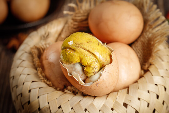 Traditional Balut Chicken Embryo Delicacy in Wicker Basket - Asian Street Food Culture