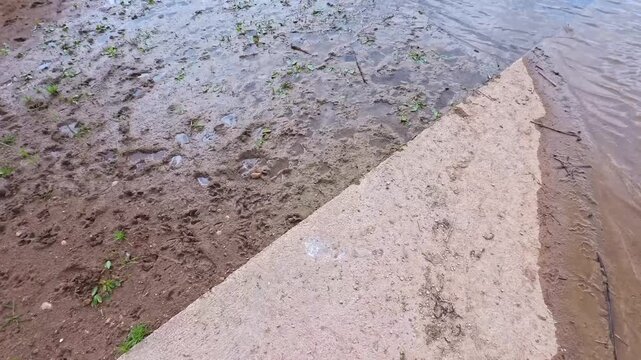 Ground Surface With Mud, Concrete and Shallow Water Detail, Brescia, Italy - PANORAMIC VIDEO - NO AUDIO