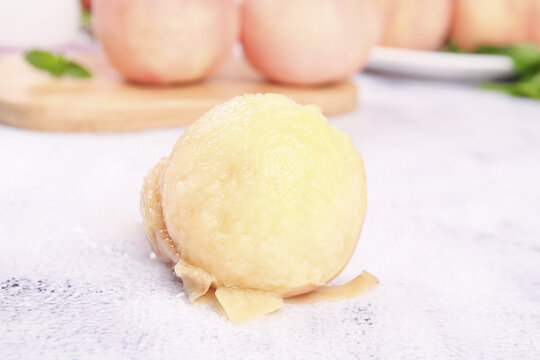 Fresh Peeled Yangshan Peach from Wuxi China Showing White Flesh on Kitchen Counter