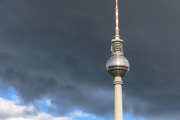 Berlin TV Tower Fernsehturm Dark Sky. Dark clouds behind the TV tower, Fernsehturm, Berlin, Germany.  © maxdigi