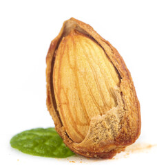 Peeled Almond Half with Mint Leaf - Healthy Natural Nut Snack Close-up on White Background © DoThi