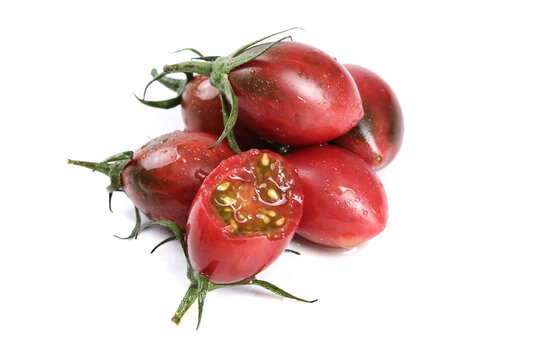 Fresh Ripe Tomatoes with Seeds Visible on White Background