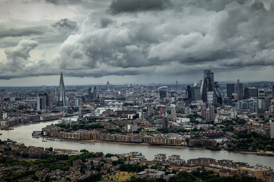 Panoramic view of the skyline of London, England, during moody weather with dark clouds and rain
