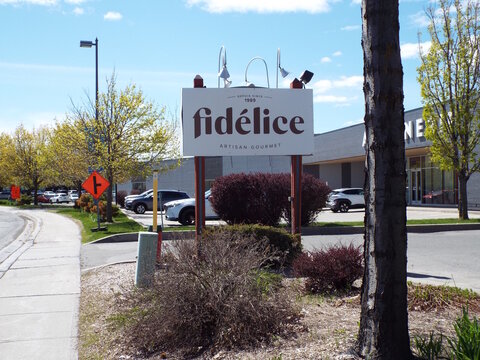 Gatineau, Quebec, Canada &ndash; May 10, 2026: A sign for "Fid&eacute;lice Artisan Gourmet" stands outside its business location on a sunny spring day on Boulevard de la Gappe.