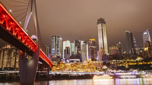 Chongqing cyberpunk city skyline with river and hongyadong night time