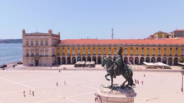 Lisbon City on Sunny Day. Commerce Plaza, Tejo River and Tourists. Portugal. Aerial Drone Shot. Orbiting
