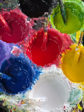 Paint palette tray with mixing sticks at a Chiang Mai workshop