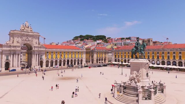 Lisbon City on Sunny Day. Commerce Plaza, Equestrian Statue, Tourists and Rua Augusta Arch. Portugal. Aerial Drone Shot. Moving Forward