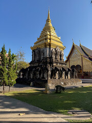 Obraz premium Golden chedi with elephant statues at Wat Chiang Man in Chiang Mai