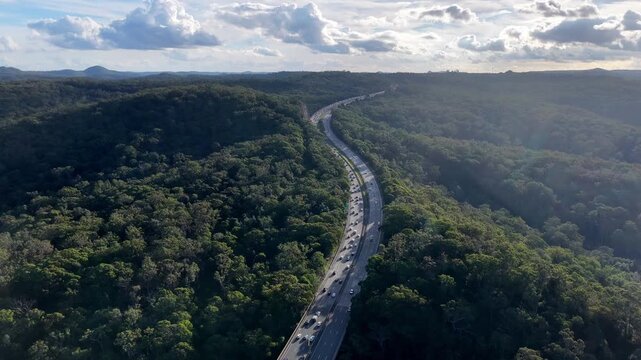 Down to Central coast creek M1 motorway in Australia heavy holiday car traffic slow drive.
