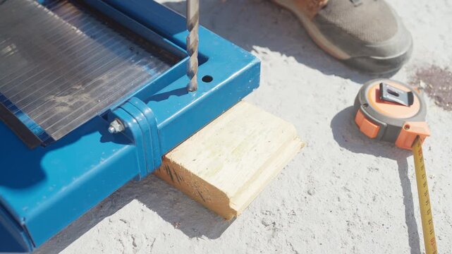Person use a drill to create precise holes in wood for a DIY project. See the tools and techniques needed for accurate work.