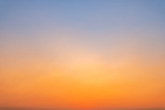 Beautiful luxury soft gradient with orange gold clouds and sunlight on the blue sky perfect for the background, take in everning,morning,Twilight, high definition landscape photo