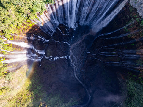 Aerial view of the Tumpak Sewu Waterfalls also known as Coban Sewu.Beautiful Tumpak Sewu Waterfalls are a tourist attraction in East Java, Indonesia.Amazing travel destination in asia