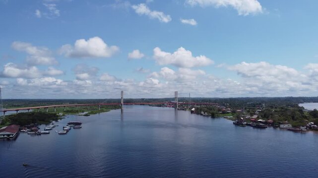 A panoramic aerial view of the Nanay Bridge in Iquitos, Peru from a high point.