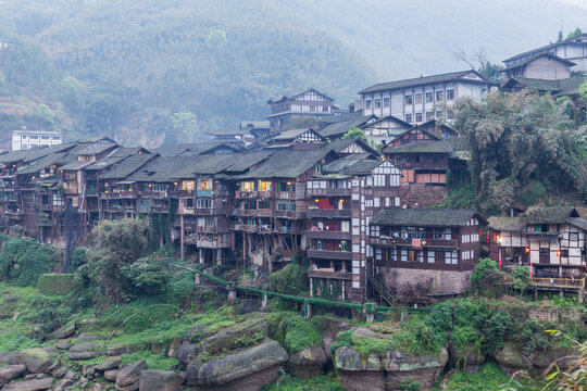Ancient Wooden Stilt Houses in Misty Zunyi Mountains, China