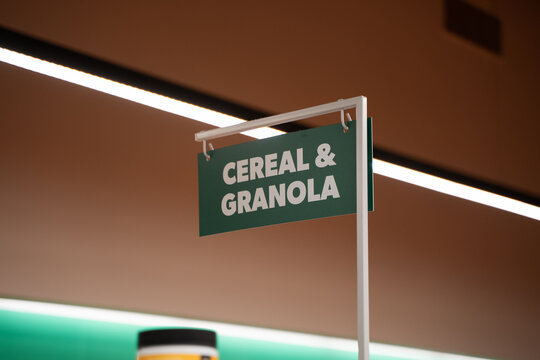 Close up of cereal and granola section sign in grocery store.