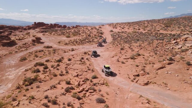 Aerial Drone View of UTVs Speeding Along Open Desert Trails in Utah