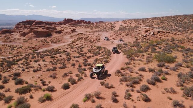 Aerial Drone View of UTVs Speeding Along Open Desert Trails in Utah