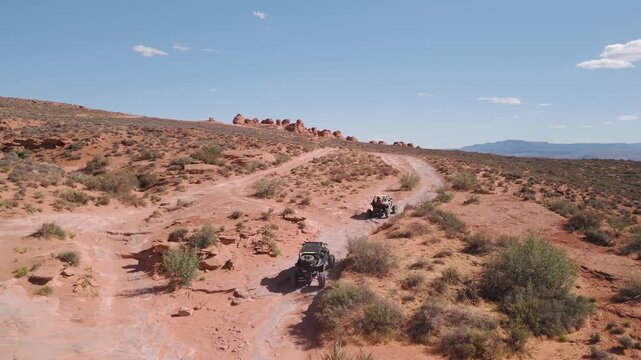Aerial Drone View of UTVs Speeding Along Open Desert Trails in Utah