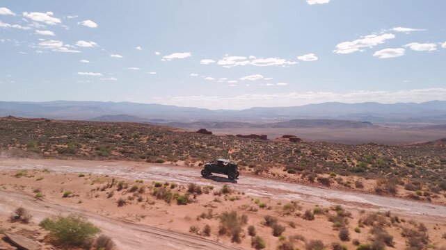 Aerial Drone View of UTVs Speeding Along Open Desert Trails in Utah