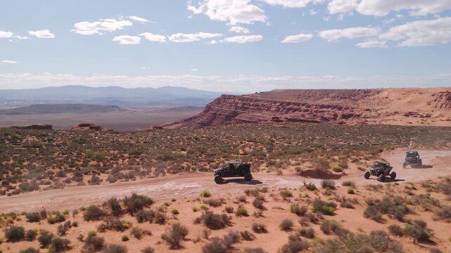 Aerial Drone View of UTVs Speeding Along Open Desert Trails in Utah