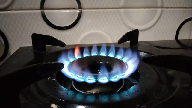 Blue gas flame burning on a kitchen stove, cooking concept