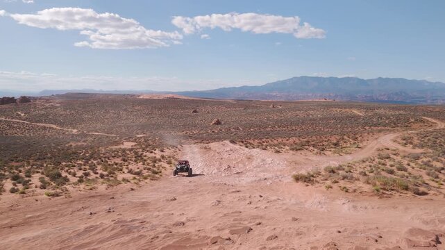 Aerial Drone View of UTVs Speeding Along Open Desert Trails in Utah