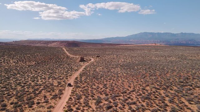 Aerial Drone View of UTVs Speeding Along Open Desert Trails in Utah