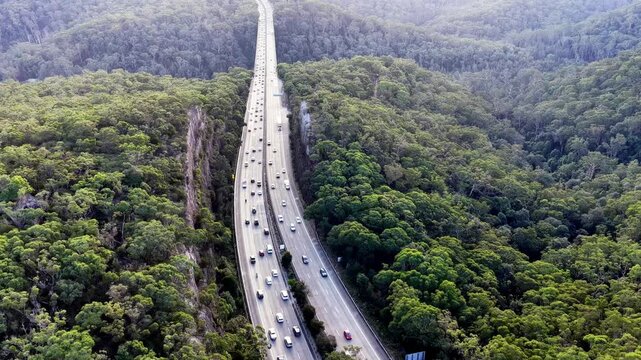 Landing over Motorway M1 Sydney Newcastle heavy holiday traffic jam cars driving.