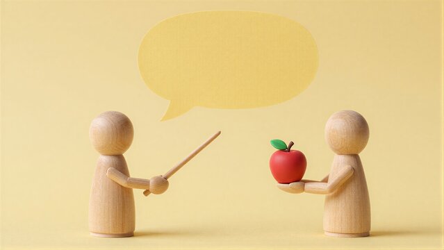 Two wooden figures converse one holding an apple under a speech