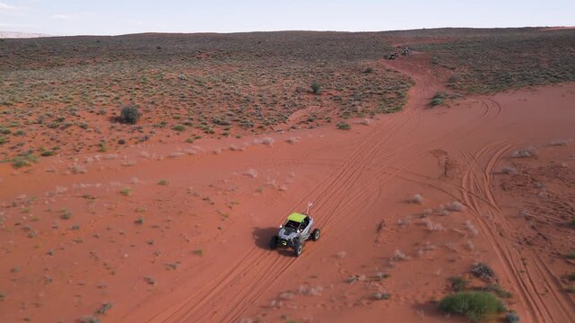 Aerial Drone View of UTVs Speeding Along Open Desert Trails in Utah