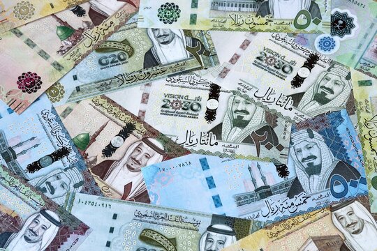 Saudi riyal money bills in pile. Big amount of Saudi Arabia SAR currency cash close up