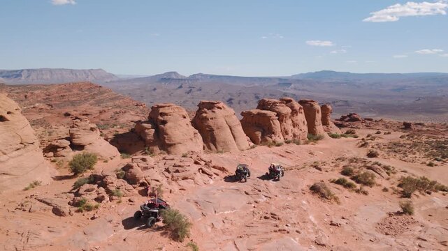 Aerial Drone View of UTVs Offroading on Red Rock Desert Trails in Utah