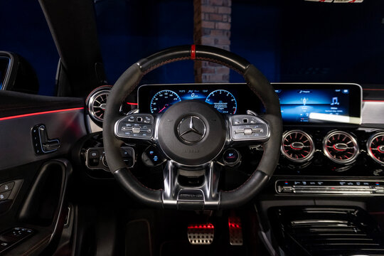 Mercedes CLA 45 S steering wheel and digital dashboard, Luxury sports sedan driver perspective