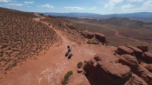 FPV Drone Cinematic Flight Around Desert Rock Pillars with UTVs and People Camping
