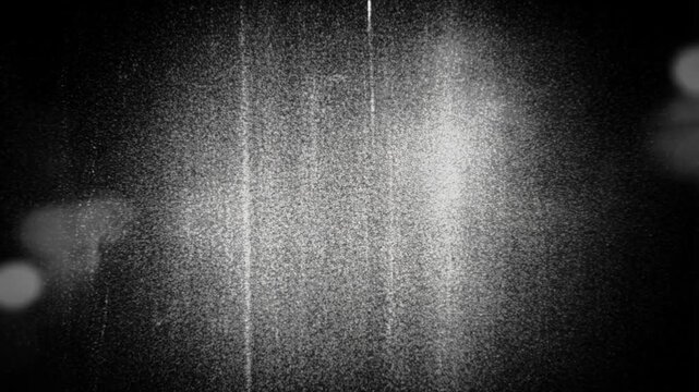 Retro Film Grain Texture: A textured background emulating vintage film grain, complete with light leaks and vertical scratches, creating an atmospheric and nostalgic aesthetic.