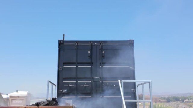 Gimbal close booming down shot of a flashover fire training module in Ventura County, California. 4K at 60 FPS Slow Motion