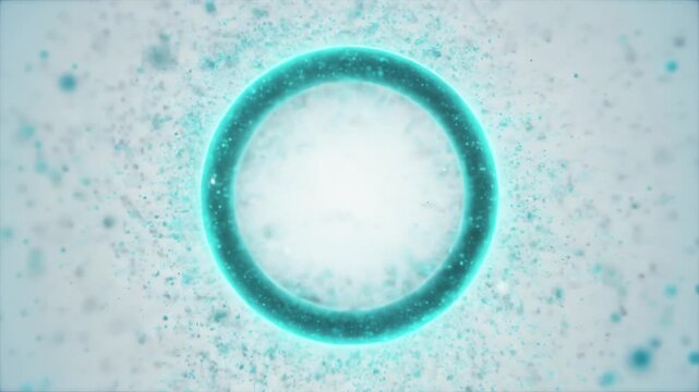 A turquoise circular ring floats against a pale blue background; its inner surface shimmering with crystals and soft light.Surrounding specks suggest droplets and motion, forming a frozen halo softly