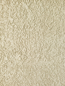 Pastel Stucco Wall Texture in Yellow Background