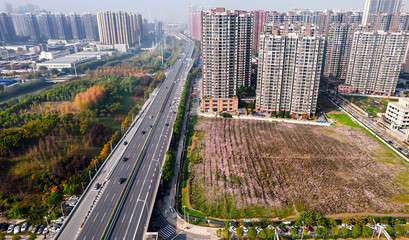 Aerial View of Wuhan Second Ring Road with High-Rise Apartments and Flower Field © NguyenMinh