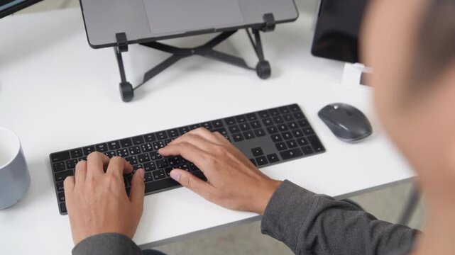 Close Up of Hands Typing on Keyboard for Remote Working Environment Using Technology