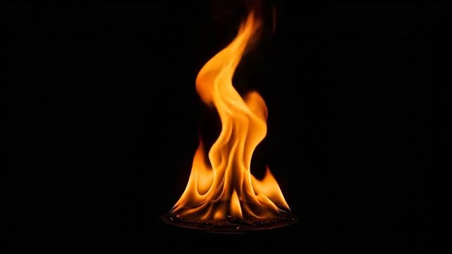 A bright orange flame burns steadily against a deep black background