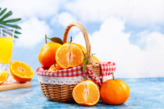 Fresh Cut Citrus Fruits in Wicker Basket Beach Picnic Scene