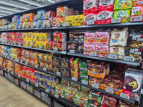 Seoul, South Korea - June 3, 2026: Various brands of Korean instant packaged noodles neatly arranged on display shelves at a large supermarket in Seoul, South Korea.