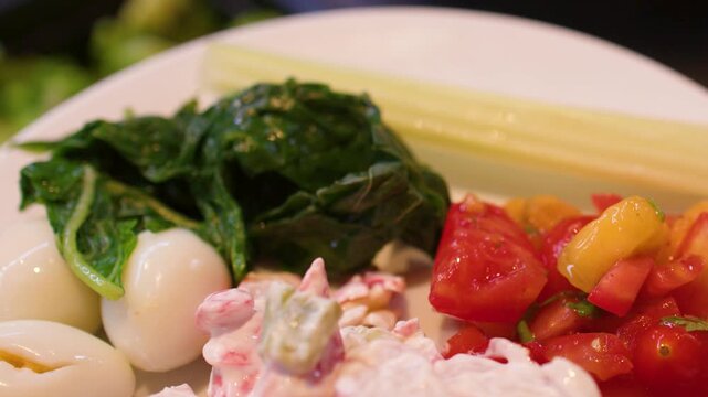 Close Up of Person Serving Fresh Salad at Buffet Bar