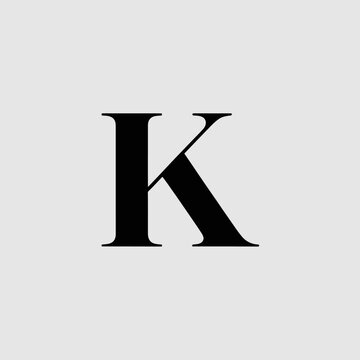 A black serif letter K is centered on a gray background