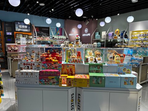 Chengdu, China - November 15, 2025: Retail display shelves filled with colorful boxed toys and merchandise inside a shop at Chengdu Shuangliu International Airport.