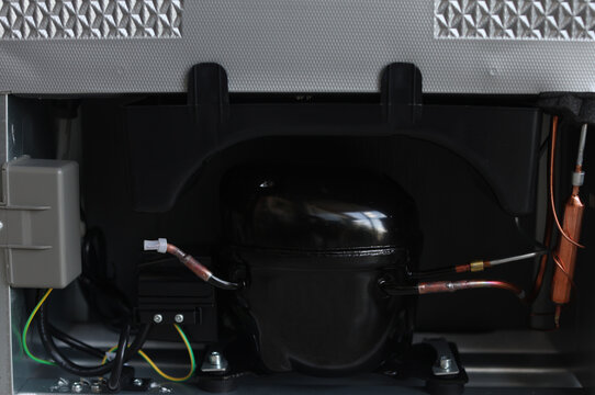 The circuit board on the back of the refrigerator compressor.