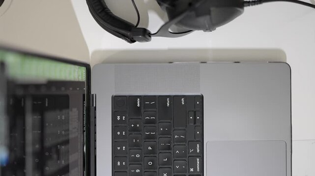 Flat lay of computer workstation with headset for online learning